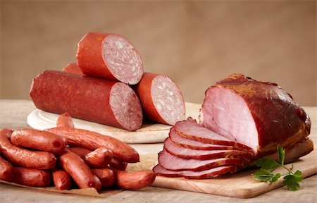 foodphoto (artist) - various types of sausages on old wooden table Fotografie stock - Microstock e Abbonamento, Codice: 400-04369585