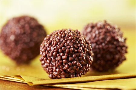 closeup of chocolate truffles on gold paper Stock Photo - Budget Royalty-Free & Subscription, Code: 400-04369581