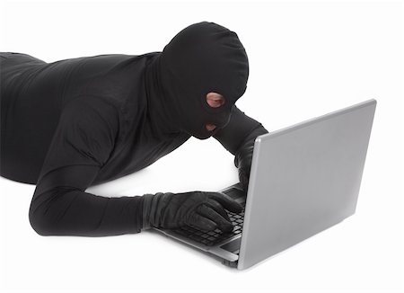 simsearch:400-06803573,k - concept of data thief with laptop isolated on white background Stock Photo - Budget Royalty-Free & Subscription, Code: 400-04369605