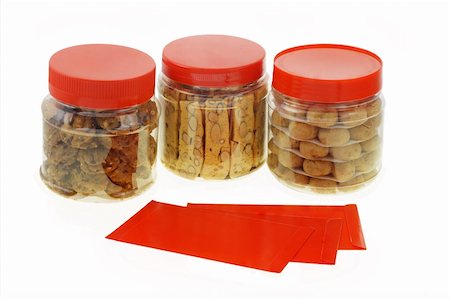 peanut cookie - Chinese New Year red packets and cookies in plastic containers Stock Photo - Budget Royalty-Free & Subscription, Code: 400-04360459