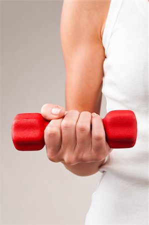 simsearch:400-04361224,k - female hand is holding a red barbell Stock Photo - Budget Royalty-Free & Subscription, Code: 400-04361217