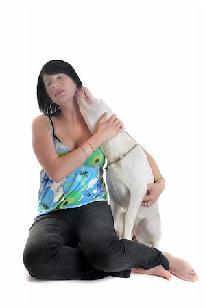 dog licking women pictures - portrait of a purebred young argentinian dog and beautiful girl in front of white background Photographie de stock - Aubaine LD & Abonnement, Code: 400-04361719