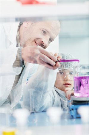 scientist and teacher photo - science and chemistry classes with teacher and young school boy at bright lab Stock Photo - Budget Royalty-Free & Subscription, Code: 400-04362429