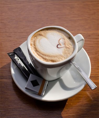 Cappuccino coffee cup closeup at the table Stockbilder - Microstock & Abonnement, Bildnummer: 400-04362490