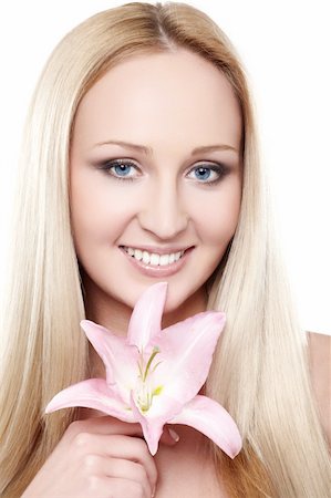simsearch:400-09081321,k - Closeup portrait of female model holding pink orchid Stock Photo - Budget Royalty-Free & Subscription, Code: 400-04363059