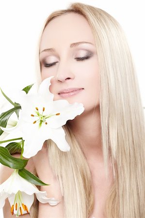 simsearch:400-04129614,k - Closeup portrait of female model holding white orchid Stock Photo - Budget Royalty-Free & Subscription, Code: 400-04363109