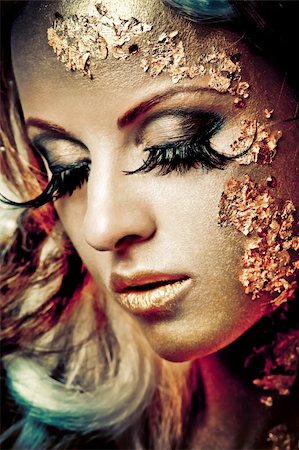 Vogue style portrait of a woman with gold makeup Stock Photo - Budget Royalty-Free & Subscription, Code: 400-04363478