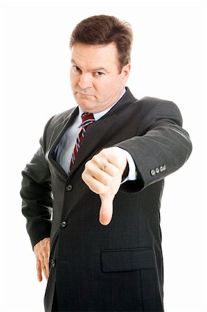 simsearch:400-05347520,k - Stern, angry looking businessman or boss giving thumbs down.  Isolated on white. Photographie de stock - Aubaine LD & Abonnement, Code: 400-04374228