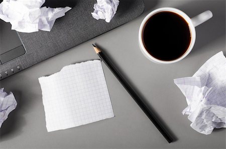 stress coffee - business creativity concept. Laptop, sheets of paper and crumpled wads on table. Stock Photo - Budget Royalty-Free & Subscription, Code: 400-04374309