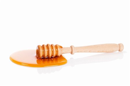 simsearch:400-07923178,k - honey dipper in a puddle of honey on white background Stock Photo - Budget Royalty-Free & Subscription, Code: 400-04375005