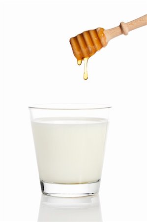 simsearch:400-06640106,k - honey drops from a honey dipper in a glass of milk on white background Stock Photo - Budget Royalty-Free & Subscription, Code: 400-04375007