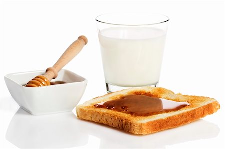 simsearch:400-06640106,k - toast with honey, a glass of milk and a honey dipper in a jar with honey on white background Stock Photo - Budget Royalty-Free & Subscription, Code: 400-04375018