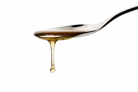 simsearch:400-07923178,k - honey drops from a spoon on white background Stock Photo - Budget Royalty-Free & Subscription, Code: 400-04375010