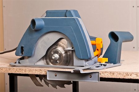 simsearch:400-04856931,k - Close-up of a circular saw on the table. Photographie de stock - Aubaine LD & Abonnement, Code: 400-04375548
