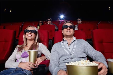 Attractive people are watching movies in cinema Stock Photo - Budget Royalty-Free & Subscription, Code: 400-04375705