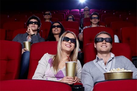 Young people in 3D glasses in cinema Stock Photo - Budget Royalty-Free & Subscription, Code: 400-04375710