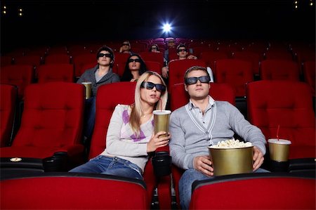 Young people watch movies in 3D glasses in cinema Stock Photo - Budget Royalty-Free & Subscription, Code: 400-04375711