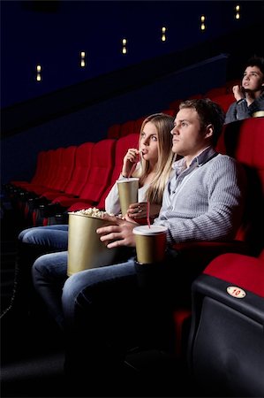A young couple in a movie theater Stock Photo - Budget Royalty-Free & Subscription, Code: 400-04375713