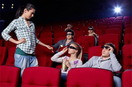 The attractive girl at a cinema makes scandal Stock Photo - Budget Royalty-Free & Subscription, Code: 400-04375731