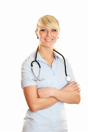 Close-up of a female doctor smiling with arms crossed. Isolated Stock Photo - Budget Royalty-Free & Subscription, Code: 400-04376263