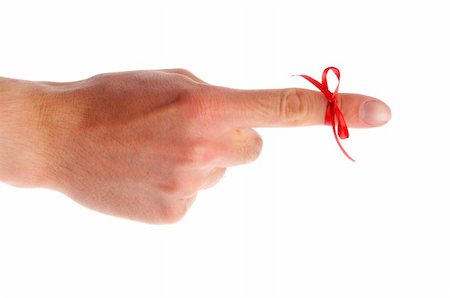 red bow on male finger showing reminder or dont forget concept in white Fotografie stock - Microstock e Abbonamento, Codice: 400-04376310