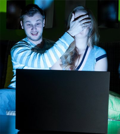 couple is watching scary movie indoors at night Stock Photo - Budget Royalty-Free & Subscription, Code: 400-04376692