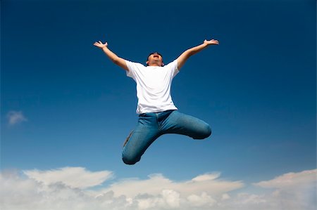 simsearch:400-05147336,k - Happy man jumping with  blue sky background Foto de stock - Super Valor sin royalties y Suscripción, Código: 400-04376834