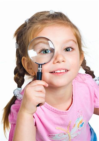 Beautiful little girl looking through a magnifying glass Stock Photo - Budget Royalty-Free & Subscription, Code: 400-04376994