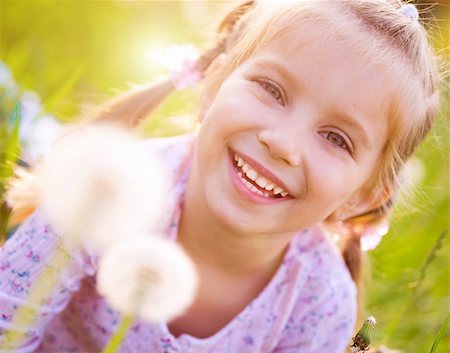 simsearch:400-06768635,k - Cute little girl  on the meadow in spring day Foto de stock - Royalty-Free Super Valor e Assinatura, Número: 400-04377359