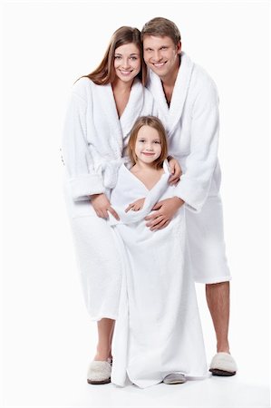 Young family with a child in overalls on a white background Foto de stock - Super Valor sin royalties y Suscripción, Código: 400-04377500