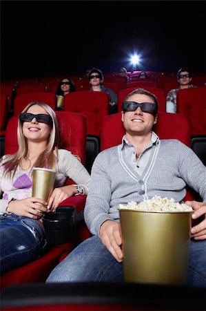 Young people watch movies in cinema Stock Photo - Budget Royalty-Free & Subscription, Code: 400-04377546