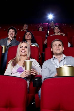 Smiling people are watching movies in cinema Stock Photo - Budget Royalty-Free & Subscription, Code: 400-04377549