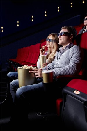 Young people in 3D glasses in cinema Stock Photo - Budget Royalty-Free & Subscription, Code: 400-04377555
