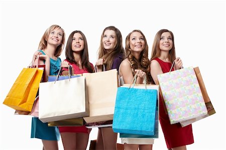 Attractive girl with shopping looking up on white background Stock Photo - Budget Royalty-Free & Subscription, Code: 400-04377586