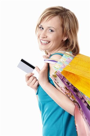 simsearch:400-04107785,k - Young girl with bags and credit card on a white background Fotografie stock - Microstock e Abbonamento, Codice: 400-04377595