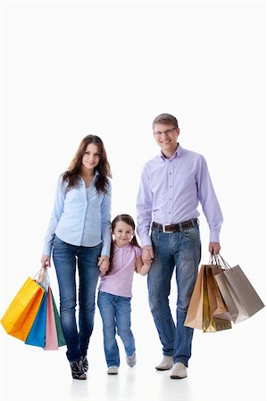 simsearch:400-04323202,k - Parents with a child with shopping on white background Stock Photo - Budget Royalty-Free & Subscription, Code: 400-04377612