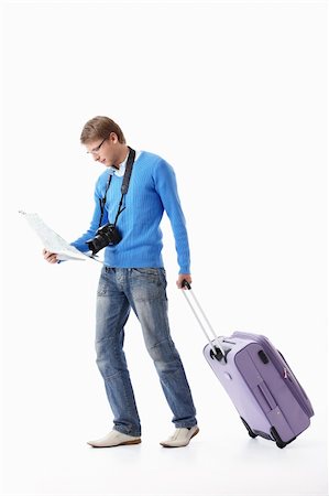 simsearch:400-07633149,k - A young man with a suitcase on a white background Stock Photo - Budget Royalty-Free & Subscription, Code: 400-04377673