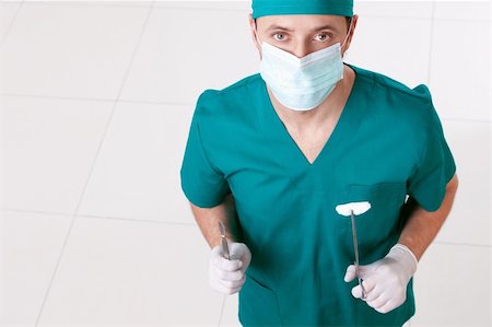 simsearch:400-04375768,k - Surgeon in mask and gloves with the tools Foto de stock - Royalty-Free Super Valor e Assinatura, Número: 400-04377709