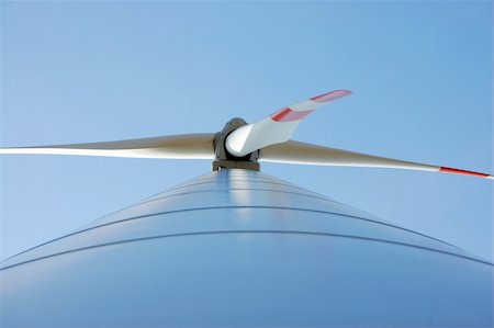 wind turbine under blue sky for alternative energy Photographie de stock - Aubaine LD & Abonnement, Code: 400-04378373
