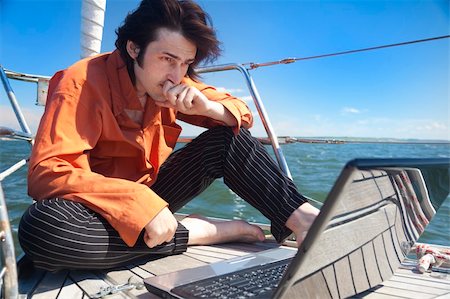 sailors deck - Businessman with laptop computer on sailboat Stock Photo - Budget Royalty-Free & Subscription, Code: 400-04378678