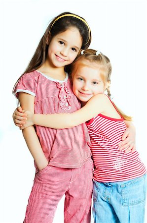 two beautiful little girls on a white background Stock Photo - Budget Royalty-Free & Subscription, Code: 400-04378932