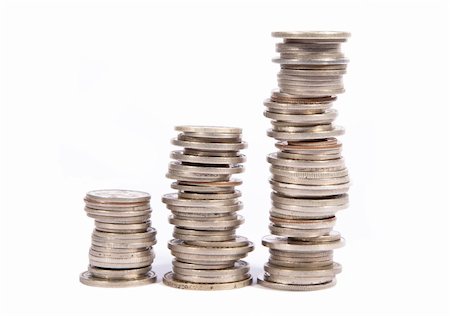 piles of cash pounds - Stacked old silver coins on white background Photographie de stock - Aubaine LD & Abonnement, Code: 400-04379248