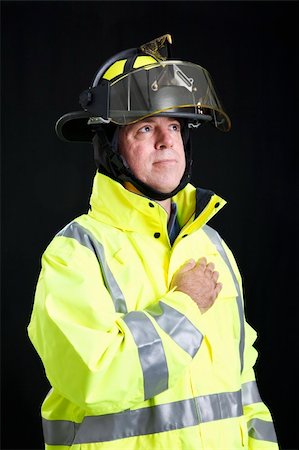 simsearch:400-04280033,k - Firefighter with his hand over his heart, pledging allegiance to the flag. Stock Photo - Budget Royalty-Free & Subscription, Code: 400-04379422