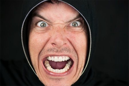 simsearch:400-06561568,k - Close-up of an furious man looking to camera. Photographie de stock - Aubaine LD & Abonnement, Code: 400-04379472