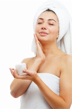 simsearch:400-04377849,k - Beautiful women applying moisturizer cosmetic cream on face. Isolated over white. Foto de stock - Super Valor sin royalties y Suscripción, Código: 400-04379680