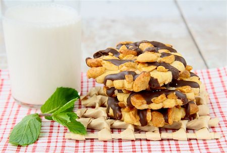 peanut cookie - homemade cookies with chocolate and nuts and a glass of milk Stock Photo - Budget Royalty-Free & Subscription, Code: 400-04379868