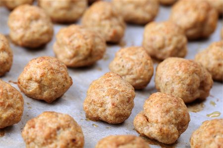 Roast meatballs on baking sheet. Shallow DOF Stock Photo - Budget Royalty-Free & Subscription, Code: 400-04370190