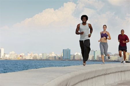 Group of young people running along the Caribbean sea in Havana, Cuba. Horizontal shape, full length, copy space Photographie de stock - Aubaine LD & Abonnement, Code: 400-04370339