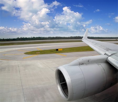 runway lights - airplane in landing runway road plane wing blue sky Stock Photo - Budget Royalty-Free & Subscription, Code: 400-04370914