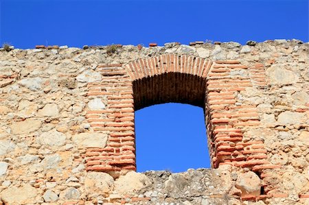 brick segmental arch in ancient masonry stone wall Spain Foto de stock - Super Valor sin royalties y Suscripción, Código: 400-04370998